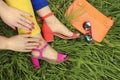 Colorful bright manicure and pedicure in different pink and orange sandals Royalty Free Stock Photo