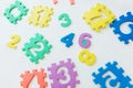 Colorful bright puzzle numbers on white background, education concept Royalty Free Stock Photo