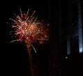 Colorful bright red fireworks and smoke in the night sky background