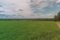 Colorful Bright Sunny Green Field, country-road, River Summer Landscape With Blue Cloudy Sky, Trees And Hills