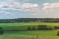 Colorful Bright Sunny Summer Green Field, River Summer Landscape With Blue Cloudy Sky, Trees And Hills