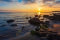 Colorful bright sunrise on rocky sea coast Royalty Free Stock Photo