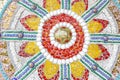 the colorful broken tile, bead, bowl and stone decorating on temple wall