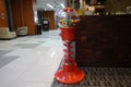 Colorful bubble gum in Coin operated gumball machine. Carousel Gumball Machine Bank kept outside a shop. - Dubai UAE January 2020