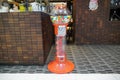 Colorful bubble gum in Coin operated gumball machine. Carousel Gumball Machine Bank kept outside a shop. - Dubai UAE January 2020