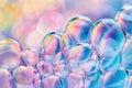 Colorful bubbles float in a bright space with blurred lights Royalty Free Stock Photo
