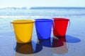 Colorful buckets on beach