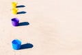 Colorful buckets on the beach sand Royalty Free Stock Photo