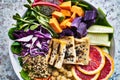 Colorful buddha bowl close up with grilled tofu