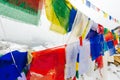 Colorful Buddhist prayer flags at blue sky in Kathmandu valley, Nepal