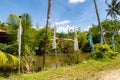 Colorful Buddhist prayer flags and pond among green tropical nature in Wei Tuo Fa Gong Buddhist Temple in Pulau Ubin Island, Royalty Free Stock Photo