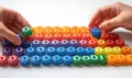 Colorful building blocks arranged by hands Royalty Free Stock Photo
