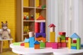 Colorful building blocks on white table in playroom Royalty Free Stock Photo