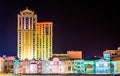 Colorful buildings along the boardwalk at night in Atlantic City