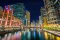 Colorful buildings along the Chicago River at night, in Chicago, Illinois Royalty Free Stock Photo