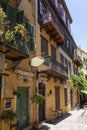Colorful buildings with beautiful metal balconies in Aggelou street in the old town of Chania, Greece