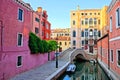 Colorful buildings and bridge lining the canals of Venice, Italy at dusk Royalty Free Stock Photo