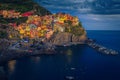 Colorful buildings on the cliffs at evening, Manarola village, Italy Royalty Free Stock Photo