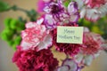 Colorful bunch of spring carnation flowers and happy mothers day words Royalty Free Stock Photo