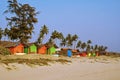 Colorful Bungalows on a Palm Beach Royalty Free Stock Photo