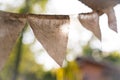 Colorful bunting flags hanging on tree with retro and vintage fi