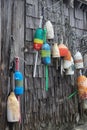 colorful buoys hanging on a weathered wood wall Royalty Free Stock Photo