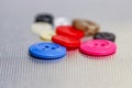 Colorful buttons on metallic background