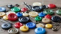Colorful buttons and sewing needles assortment Royalty Free Stock Photo