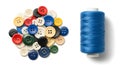 Colorful Buttons and a Spool of Blue Thread on White Backdrop Royalty Free Stock Photo