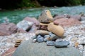 Colorful cairn pile of rocks near a stream