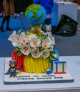 Colorful cake of flowers and olympic mascots make of chocolate