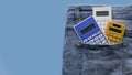 Colorful calculator in a pocket of blue jeans Royalty Free Stock Photo