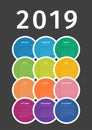 Colorful 2019 calendar from multicolored circles on dark background