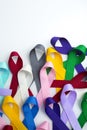 Multi colored cancer ribbon background. Proudly worn by patients, supporters and survivors for world cancer day. Bringing awarenes