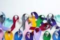 Multi colored cancer ribbon background. Proudly worn by patients, supporters and survivors for world cancer day. Bringing awarenes