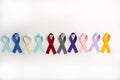 Colorful cancer ribbons as Health symbols for all types of cancer in a row