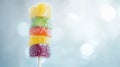 Colorful Candied Fruit Skewer with Sugar Crystals on Bright Background Royalty Free Stock Photo