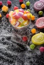 Colorful candies, jelly and marmalade and jellybeans around a ce Royalty Free Stock Photo