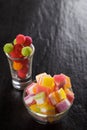 Colorful candies, jelly and marmalade and jellybeans around a ce Royalty Free Stock Photo