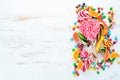 Colorful candies, jelly and marmalade on a white wooden background. Sweets. Top view.