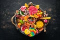 Colorful candies, jelly and marmalade in a wooden box. Sweets. On the old background. Top view. Royalty Free Stock Photo