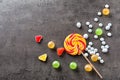 Colorful candies with lollipop on grey background Royalty Free Stock Photo
