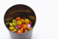 Colorful candies in pots isolated on white background. Colorful chocolate balls Royalty Free Stock Photo