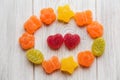 Colorful candies and red heart shape jelly candies.white wooden Royalty Free Stock Photo