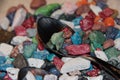 Colorful candies on a spoon. Chocolate in the form of stones Royalty Free Stock Photo