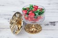 Colorful candies strawberry candies in stylish sugar bowl on white wooden table. Candies in luxury sugar bowl with white wooden Royalty Free Stock Photo