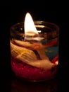 Colorful candle light shining in dark room Royalty Free Stock Photo