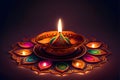 Colorful candle in the shape of a Lotus flower on a dark background. Diwali, the dipawali Indian festival of light