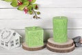 Colorful candle of various shapes on wooden background. Scented candle.