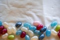 Colorful candy beans placed on top of a white background crumpled paper Royalty Free Stock Photo